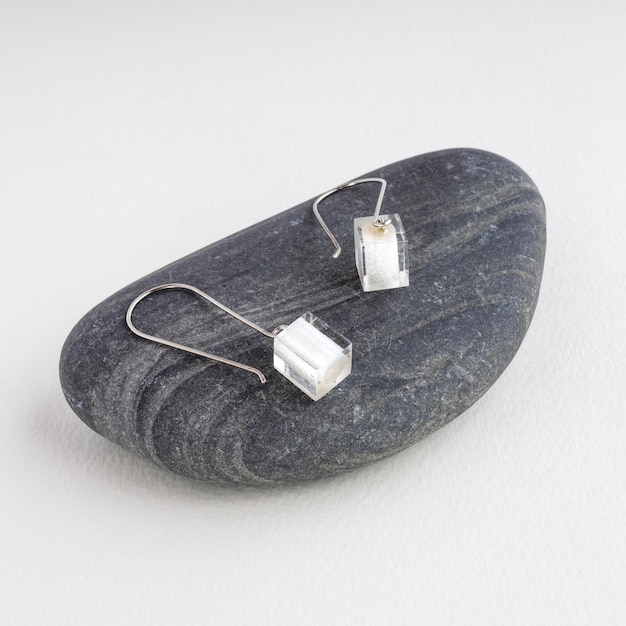Photo jewelry fashion.brught earrings presented on a stone