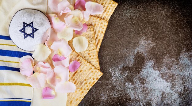 Jewish family celebrating passover matzoh jewish unleavened bread holiday on talit and kippa