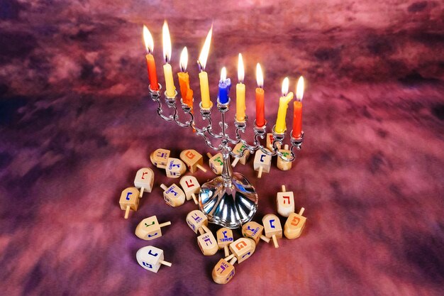 Jewish holiday Hanukkah creative background with menorah View from above with focus on menorah R