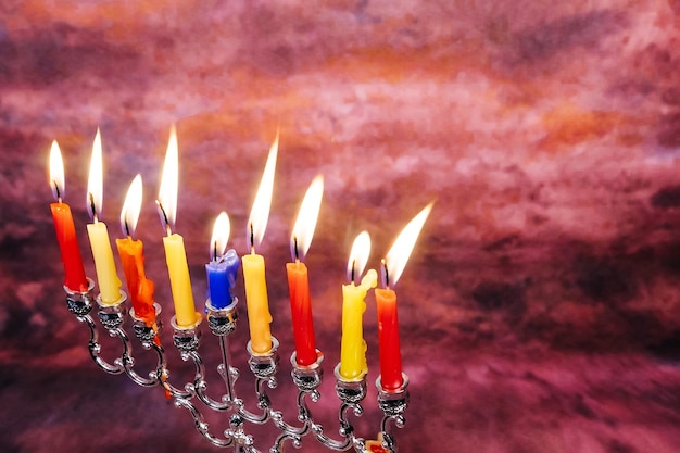 Jewish holiday Hanukkah creative background with menorah View from above with focus on menorah