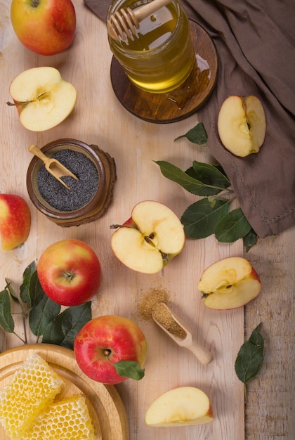 Jewish holiday Rosh Hashana surface with apples and honey on blackboard. View from above. Flat lay