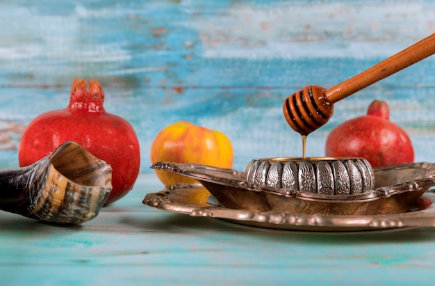 Jewish Holiday Yom Kippur and Rosh Hashanah honey and apples with pomegranate