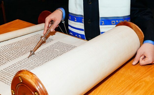 Jewish man dressed in ritual clothing Torah at Bar Mitzvah