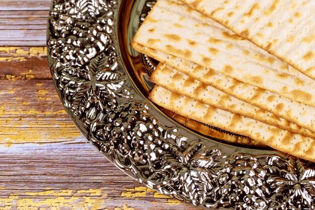 Jewish matza passover bread on metallic plate