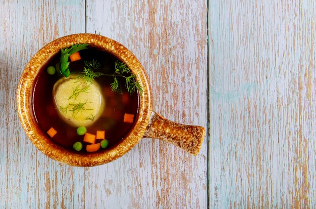 Jewish matzo ball soup with vegetables