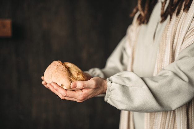 Jezus Christus met brood in handen, heilig voedsel