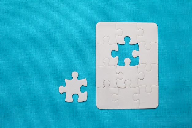 Jigsaw puzzle on blue background