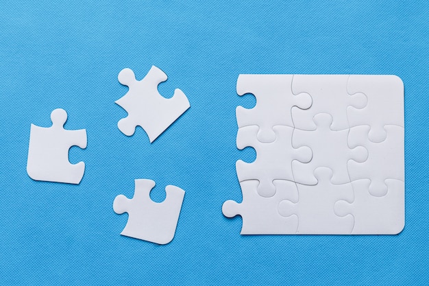 Jigsaw puzzle on blue background