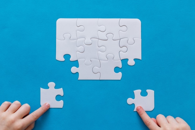 Jigsaw puzzle on blue background