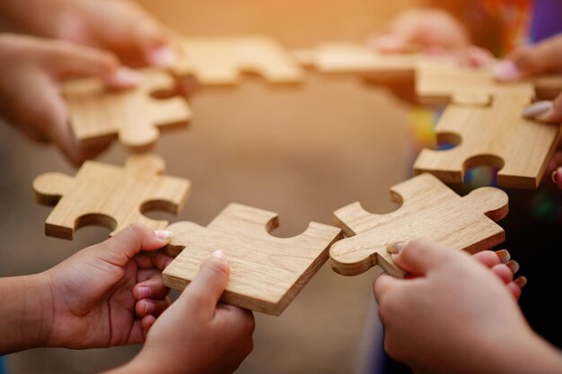 Jigsaw puzzle pieces group together unite strength unity teamwork communication connection teamwork concept