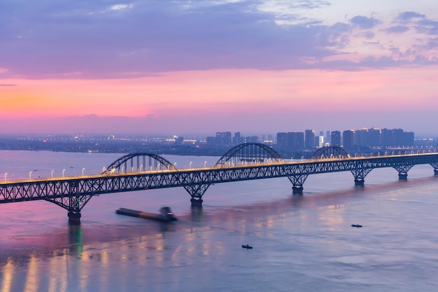 Jiujiang yangtze river bridge in nightfall with beautiful summer sky color China