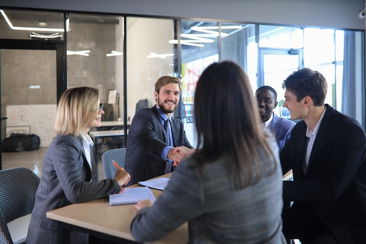 Photo job applicant having interview. handshake while job interviewing.