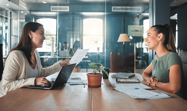 Job interview for a business woman at a hiring company talking to the HR manager about the role or position Young female applicant or candidate in a meeting with an employer having a discussion