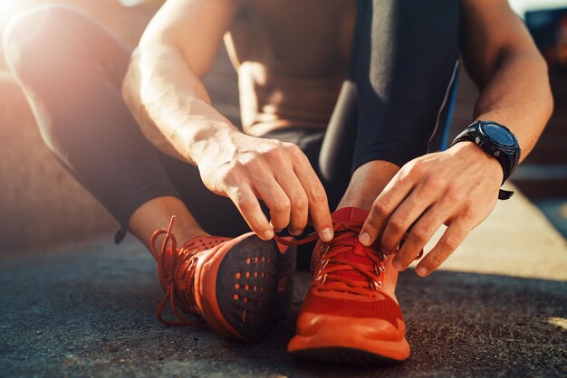 Jogger tying shoe before jogging