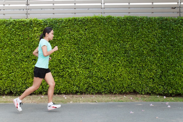 Jogging woman running in park 