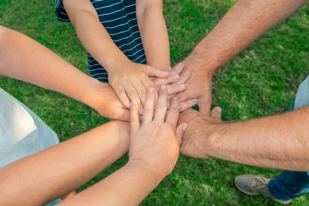 Joined hands as a team Business teamwork Close up group of multiracial friends meeting join hands together Diversity people Partnership volunteer community Diverse multiethnic Partners Top View