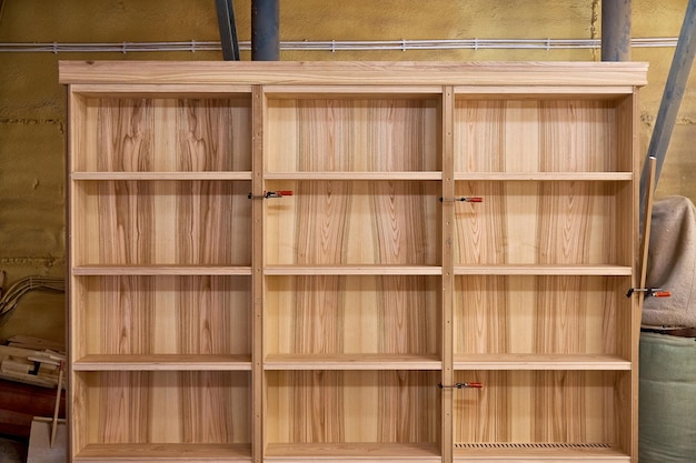 Photo joinery ash veneered mdf bookcase in workshop wooden furniture details wood production