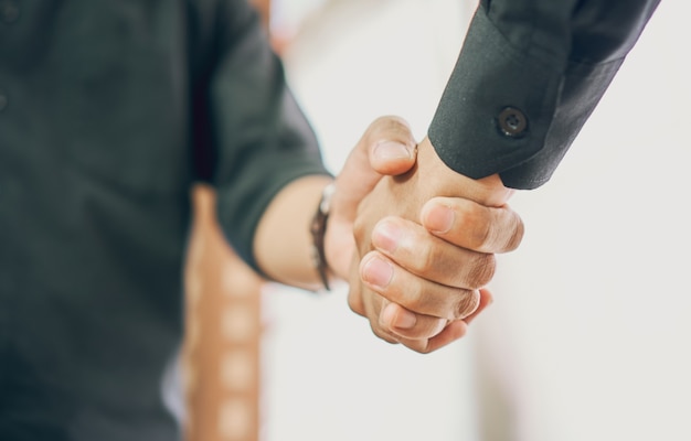 Joint Hands of Two Businessmen