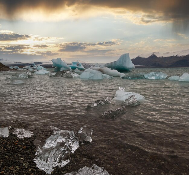 Jokulsarlon glacial lake lagoon with ice blocks Iceland Situated near the edge of the Atlantic Ocean at the head of the Breidamerkurjokull glacier Vatnajokull icecap or Vatna Glacier