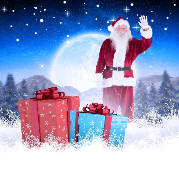 거대한 보름달 아래 귀여운 크리스마스 마을을 배경으로 카메라를 향해 손을 흔드는 졸리 산타