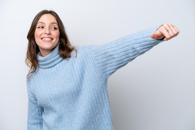 Foto jonge blanke vrouw geïsoleerd op een witte achtergrond met een duim omhoog gebaar