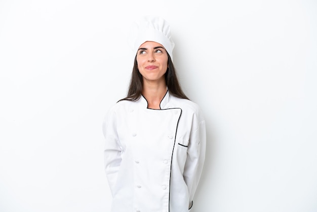 Jonge chef-kok vrouw op witte achtergrond en opzoeken