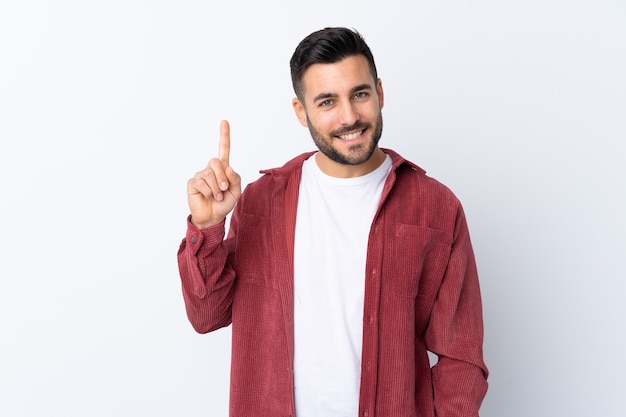 Jonge knappe man met baard, gekleed in een corduroy jasje geïsoleerd