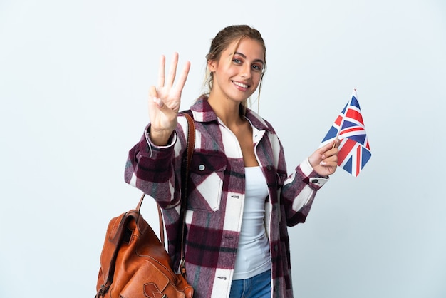 Jonge vrouw met een Britse vlag poseren geïsoleerd tegen de blinde muur