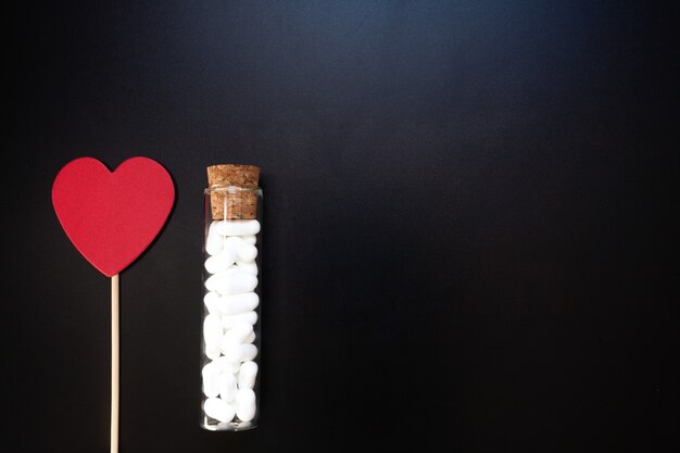 Photo jordan almonds and heart shape. wedding decoration on black