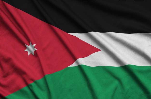 Jordan flag  is depicted on a sports cloth fabric with many folds.