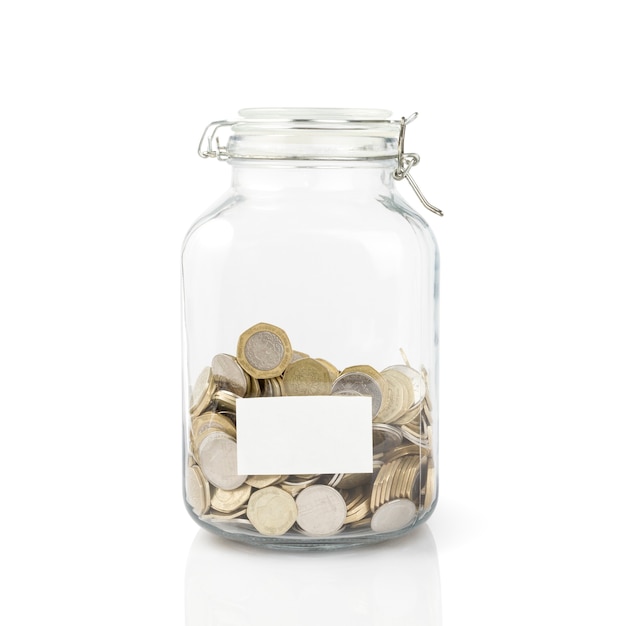 Jordanian currency coins in glass jar