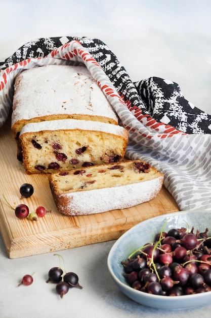 Jostaberry sponge cake on wooden cutting board