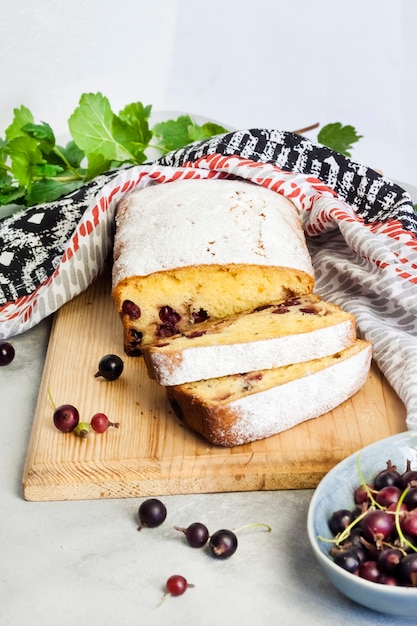 Jostaberry sponge cake on wooden cutting board