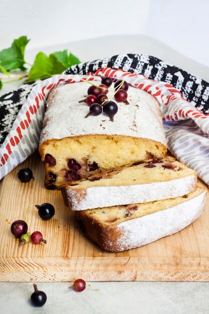 Jostaberry sponge cake on wooden cutting board