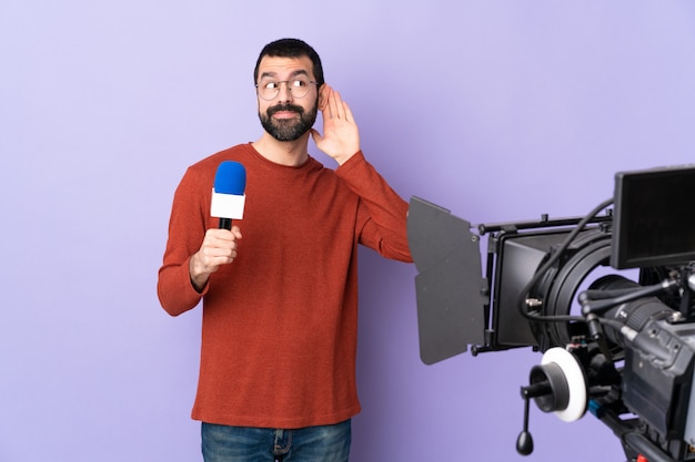 Journalist man over isolated purple background