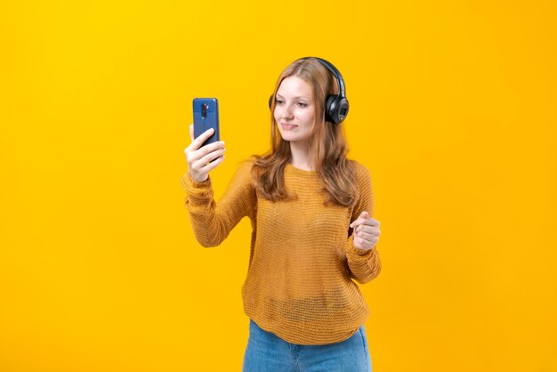 Joy and music colorful studio portrait of a happy young woman with headphones