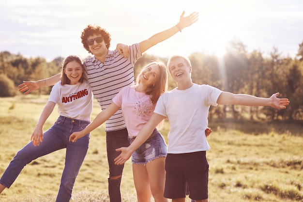 Joyful best fellows celebrate something outdoor