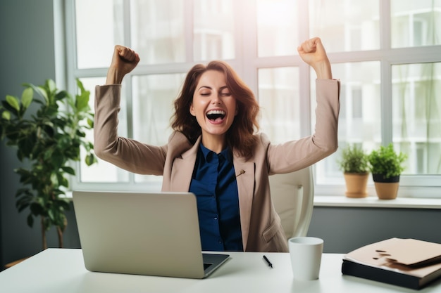 Joyful business woman freelancer entrepreneur smiling and rejoices in victory while sitting at desk