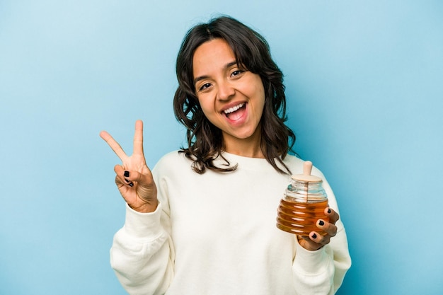 Joyful and carefree showing a peace symbol with fingers