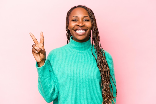 Joyful and carefree showing a peace symbol with fingers