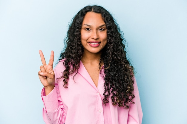 Joyful and carefree showing a peace symbol with fingers