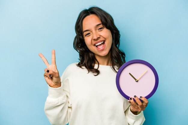 Joyful and carefree showing a peace symbol with fingers