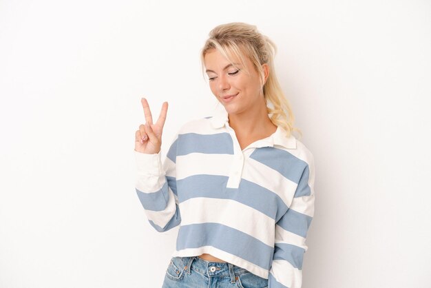 Joyful and carefree showing a peace symbol with fingers