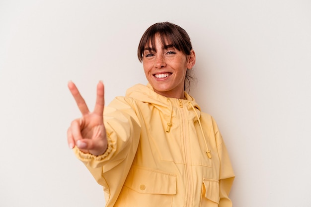 Joyful and carefree showing a peace symbol with fingers