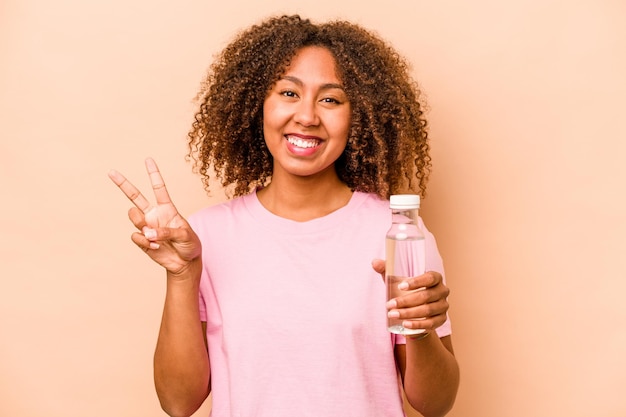 Joyful and carefree showing a peace symbol with fingers