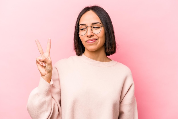 Joyful and carefree showing a peace symbol with fingers