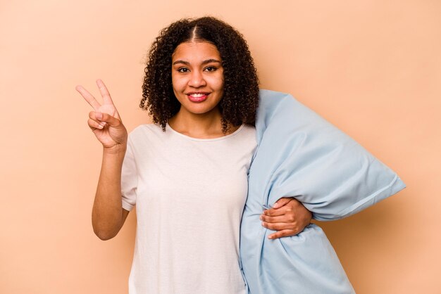 Joyful and carefree showing a peace symbol with fingers