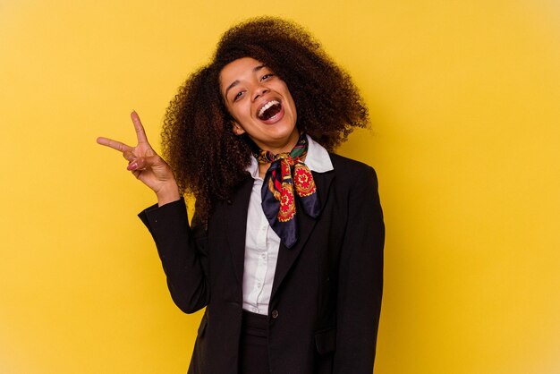 Joyful and carefree showing a peace symbol with fingers