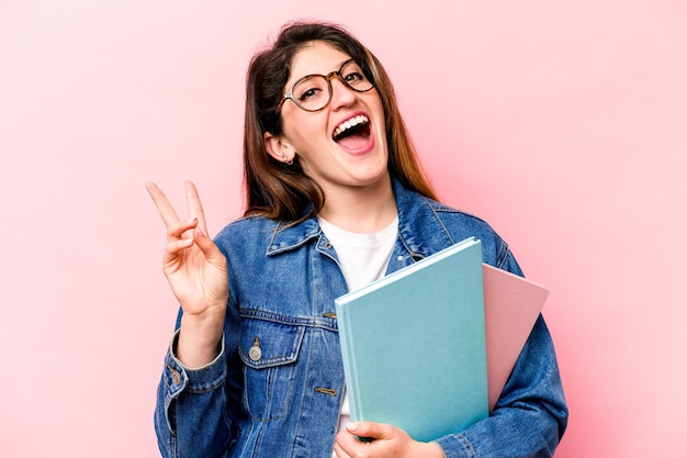 Joyful and carefree showing a peace symbol with fingers