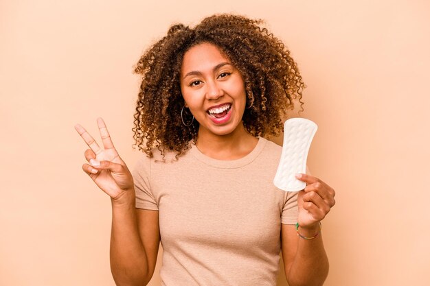 Joyful and carefree showing a peace symbol with fingers